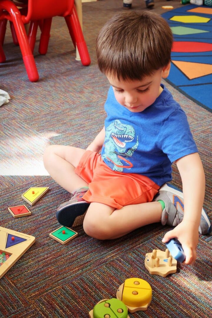 a young boy playing puzzles
